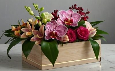 Arreglo floral en caja con rosas, lirios y orquídeas